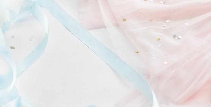 Image of light blue and light pink ribbon and lace with gold stars. Light Wave Archive #12