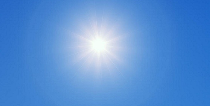 Image of a magnificent sun against a blue sky background. Earth Enters the New Dream-A Message from the Tao of Inner Earth
