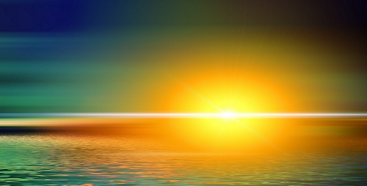 Image of a sunset with a dimming yellow orange sun in the horizon. Uniting Inner and Outer Earth