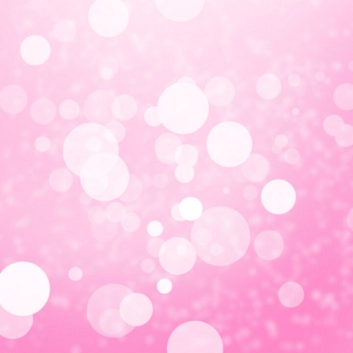 Image of light orbs with pink background,