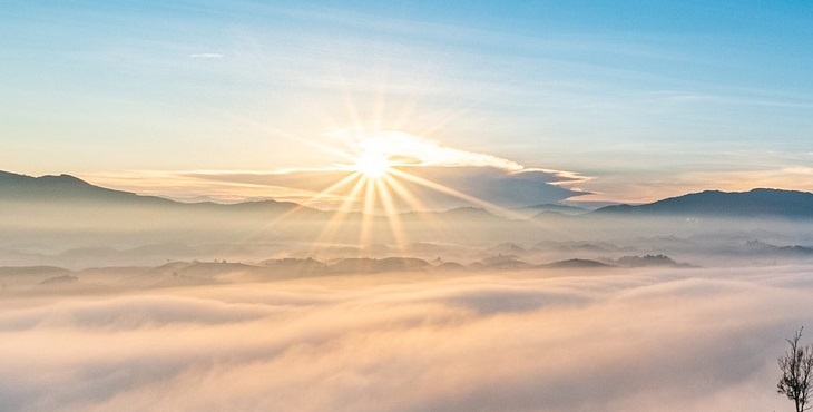 Image of the bright Sun above the clouds