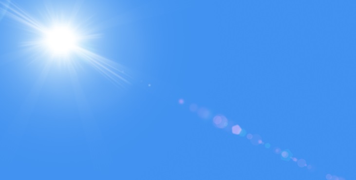 Image of the dazzling Sun high up in the deep blue sky